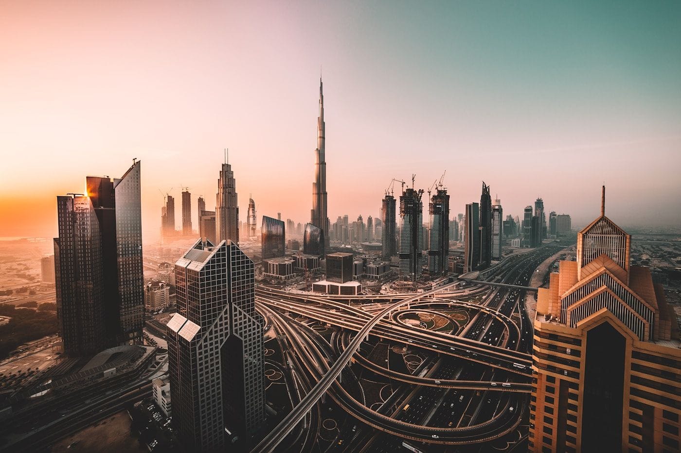 Dubai skyline glowing at blue hour
